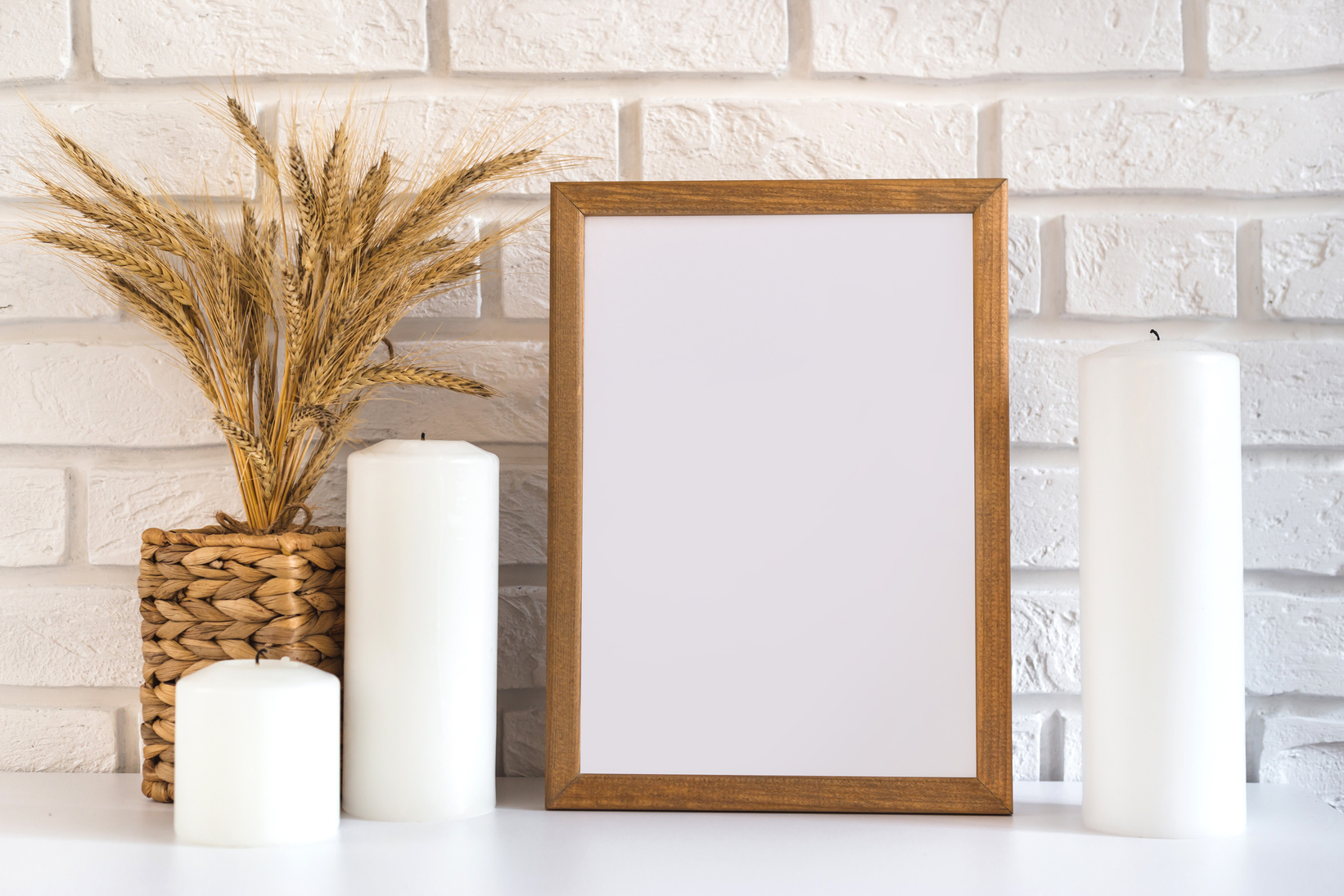 Blank Wooden Picture Frame at the White Brick Wall